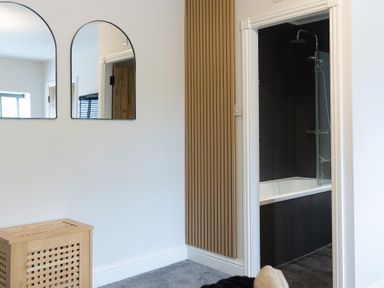 A bathroom with a shower and bathtub at 6 Front Street
