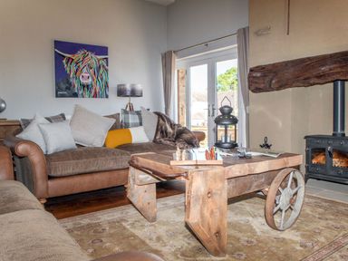 A living room with a sofa and a coffee table at The Granary in Durham