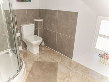 A bathroom with a shower and toilet at The Granary in Durham