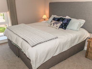 A bedroom with a bed and lamp at The Granary in Durham