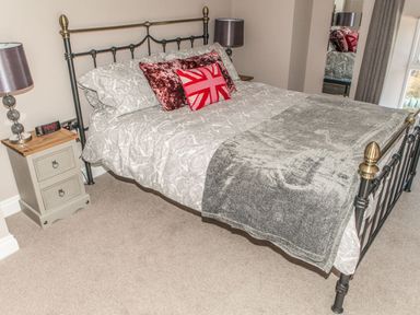 A bedroom with a bed and bedside table at The Granary in Durham