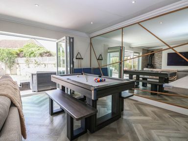 A games room with a pool table and outdoor area at Cootiya Corner in Great Lyth