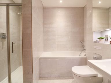 A bathroom with a bathtub and shower at East View in Cheltenham
