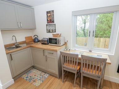 A kitchen with a sink and countertop at Heidiaway Lodge in Gilfach Goch