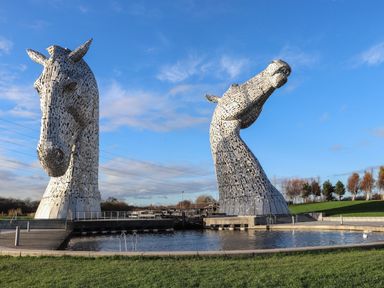 Two large horse sculptures near water at the Kelpies in Falkirk