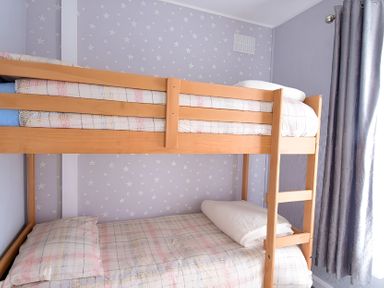 A bunk bed with pillows and bed linen at 226 Third Avenue in Bridlington
