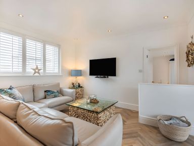 A living room with a sofa and coffee table at 6 Tegafan in Abergele