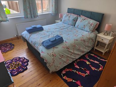 A bedroom with a bed and bedside table at 17 Castleview in Ballymena