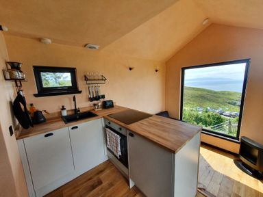 A kitchen with a stove and sink at Cullinview Isle of Skye