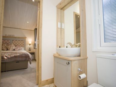 A bathroom with a sink and toilet at Orchid 9 in Christchurch