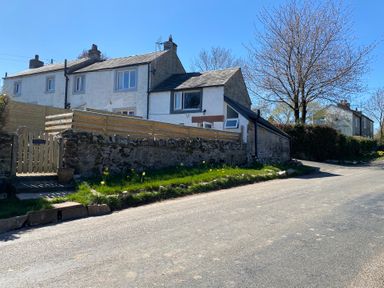 A house with a fence and garden near a road at The Haven in Penrith