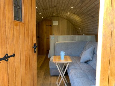 A living space with a sofa and table at Cosy Escape in Sheerness