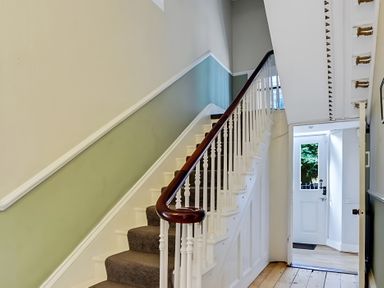 A staircase leading to the upper floor in Fountain Hill House Londonderry