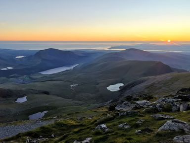 A mountainous landscape during sunset at Sea view cottage in Penmaenmawr