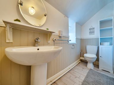 A bathroom with a sink and toilet at Sea view cottage Penmaenmawr