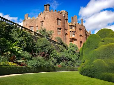 A castle with garden and topiary at Honey Bee Cottage in Welshpool