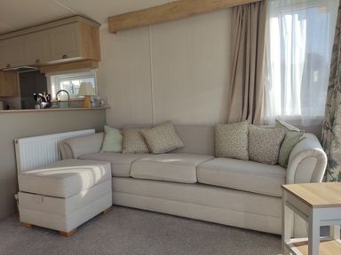 A living room with a sofa and coffee table at Harbour View in Poole