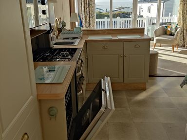 A kitchen with an oven and sink at Harbour View in Poole