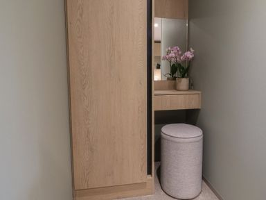 A vanity with a mirror and a plant at The Pines 3 Bedrooms Delamere