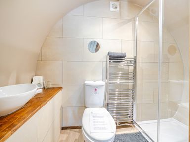 A bathroom with a shower and sink at Cosy Escape Minster On Sea