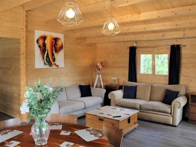 A living room with a sofa and table at Cotswold Nights Away in Evesham