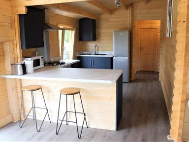 A kitchen with a refrigerator, stove, and sink at Cotswold Nights Away, Evesham
