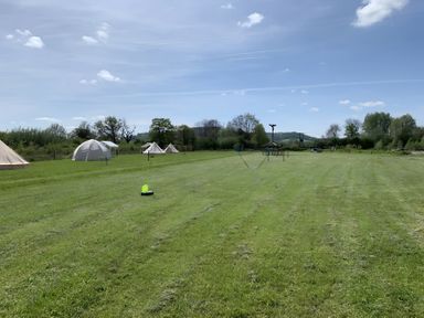 An outdoor area with tents and play equipment at Cotswold Nights Away Evesham