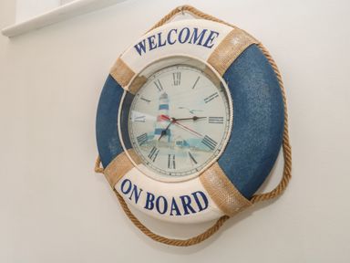 A wall clock designed as a lifebuoy at Tudor Rose in Weymouth
