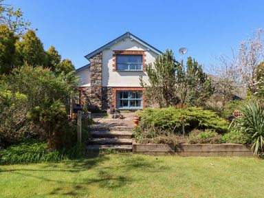 A house with a garden and steps at Pillars in Barnstaple