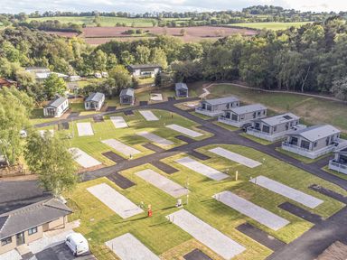 A view of cabins and roads in a park at Cedar Lodge 3 Bedrooms with hot tub Delamere