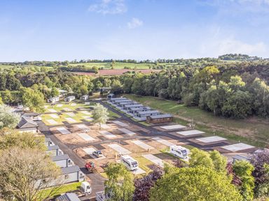 An outdoor area with parking spaces at the caravan park Cedar Lodge 3 Bedrooms with hot tub in Delamere