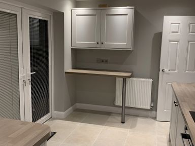 A kitchen with cabinets and a worktop at 43 Goose Green Road in King's Lynn