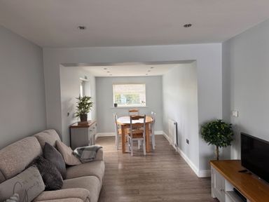 A living room with a dining table and sofa at 15 Lamsey Lane King's Lynn