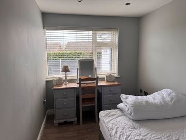 A bedroom with a desk and chair at 15 Lamsey Lane King's Lynn
