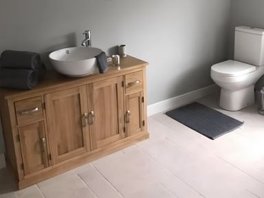 A bathroom with a wash basin and toilet at 15 Lamsey Lane King's Lynn