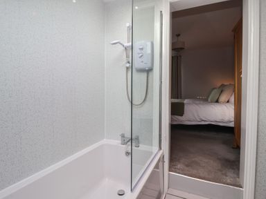 A bathroom with a bathtub and shower at No.4 Main Street in Hull