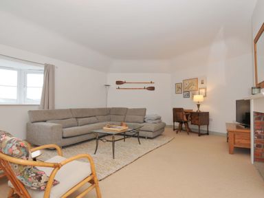 A living room with a sofa and coffee table at Cribba in Port Isaac