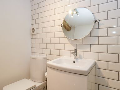 A bathroom with a toilet and sink at No.2 The Flags, Grange-over-Sands