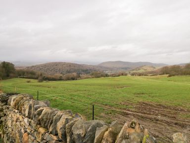 A view of hills and grassy fields with a stone wall at No.2 The Flags Grange-over-Sands