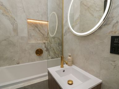 A bathroom with a bathtub and sink at Low House Cottage Ayside near Newby Bridge
