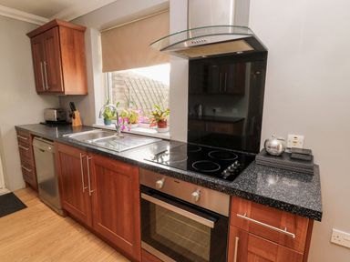 A kitchen with a sink and stove at Megstone in Chathill