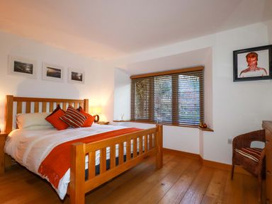 A bedroom with a bed and window at Kerslake House Crafthole