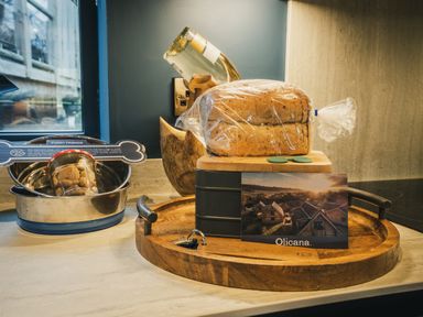 A kitchen counter with bread on a wooden board at The Lookout in Addingham