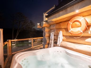 An outdoor deck with a hot tub at The Lookout in Addingham