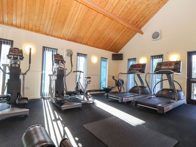 A gym with exercise equipment and a floor mat at Pentewan - 67 Portreath