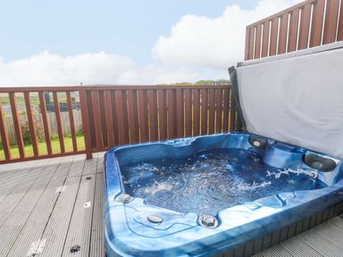 A hot tub on a deck in Pentewan - 67 Portreath