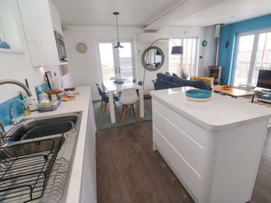 A kitchen with dining area at Pentewan - 67 in Portreath