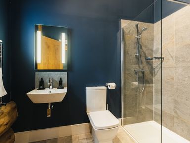 A bathroom with a sink and shower at The Farmhouse in Addingham