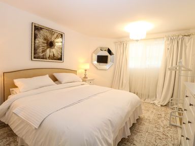 A bedroom with a bed and nightstand at Three Ways South Lopham near Garboldisham