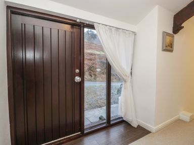 An entrance with a front door and window at Newlands Fell House in Newlands near Keswick
